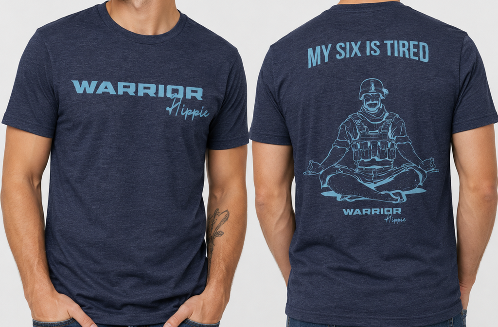A man modeling a heather navy blue t-shirt, showing both the front and back views. The front features the text 'WARRIOR Hippie' in light blue, while the back displays a light blue meditating graphic with the text 'MY SIX IS TIRED' and 'WARRIOR Hippie'.